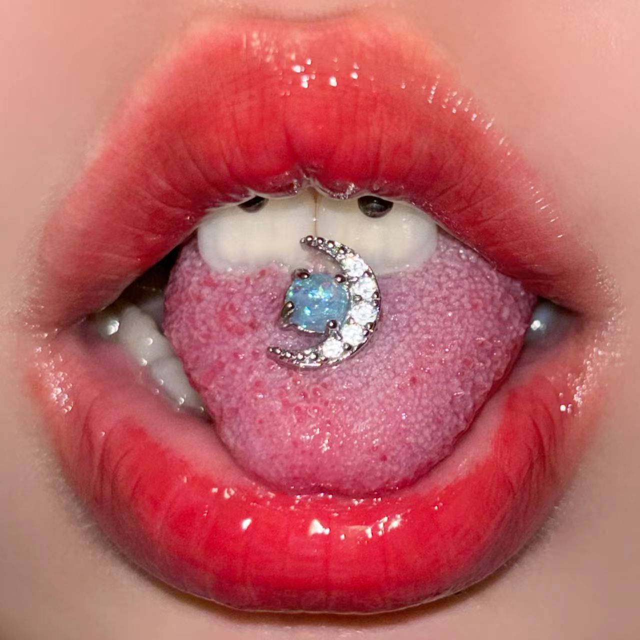 Moon tongue nail imitation Aobao stainless steel tongue decoration with zircon four-color tongue ring